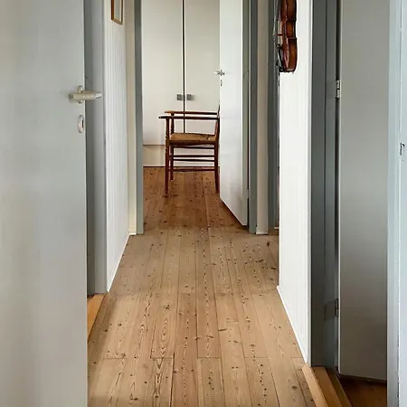 Wooden House In The Dunes Close To The Sea