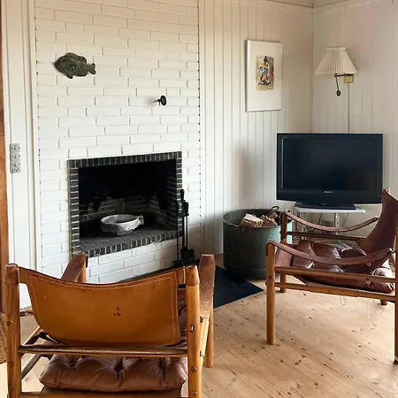 Wooden House In The Dunes Close To The Sea