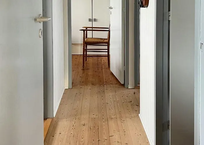 Wooden House In The Dunes Close To The Sea
