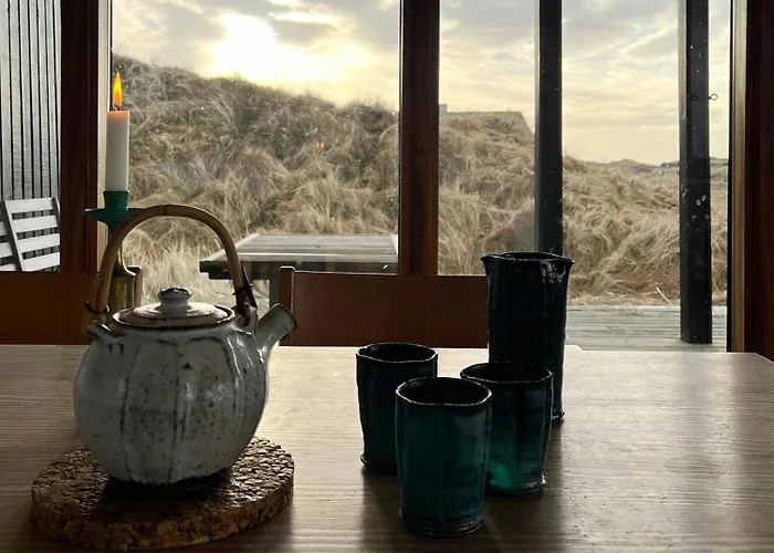 Wooden House In The Dunes Close To The Sea