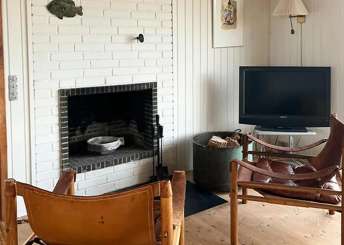 Wooden House In The Dunes Close To The Sea